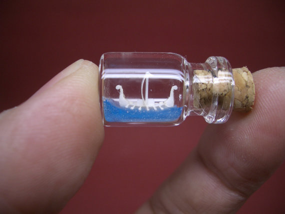 Tiny Viking Ship in the ocean is in a tiny bottle  -Bottle ship-