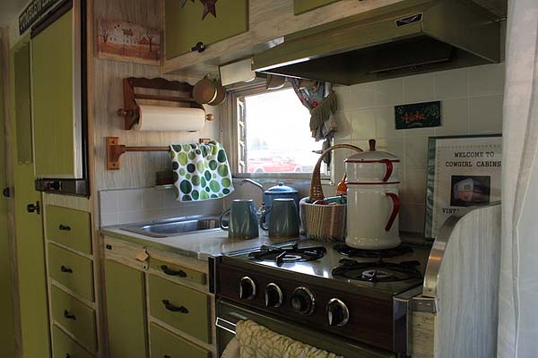 kitchen of green vintage trailer
